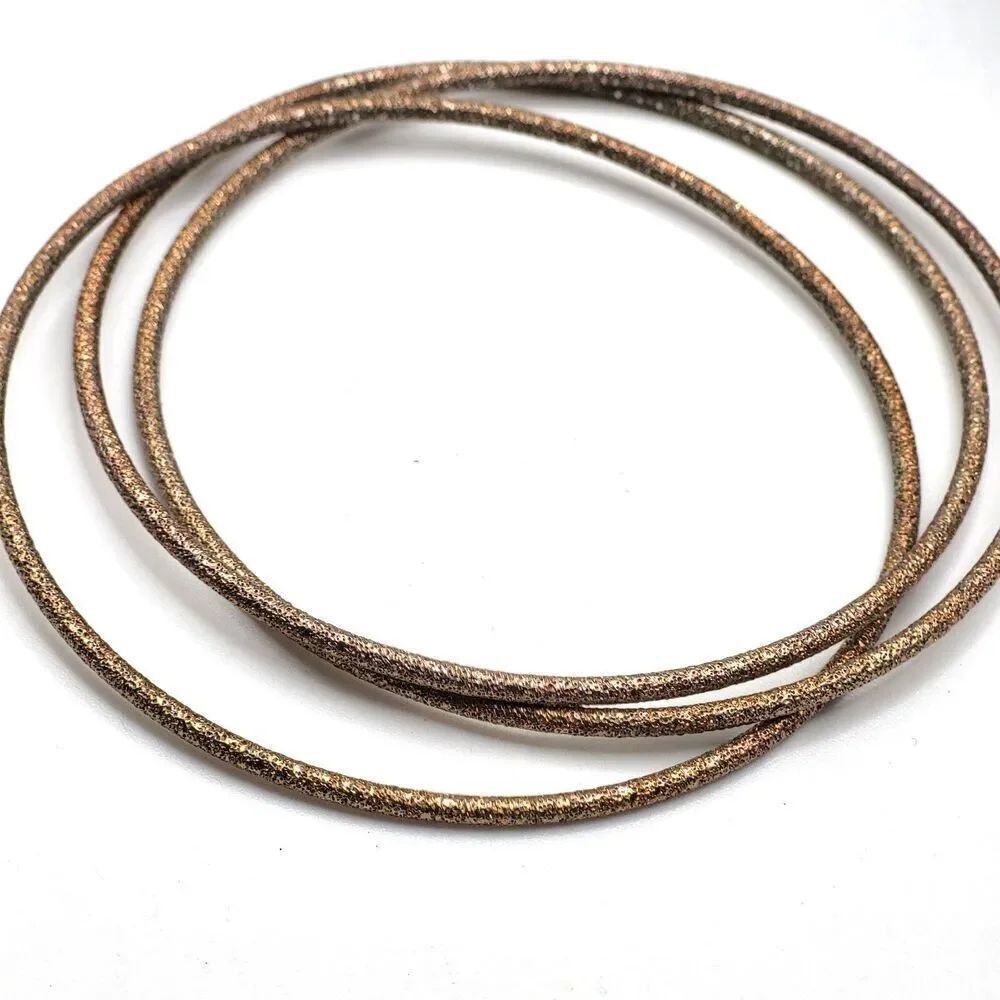Interlocking Gold Bracelets 2.75in dia